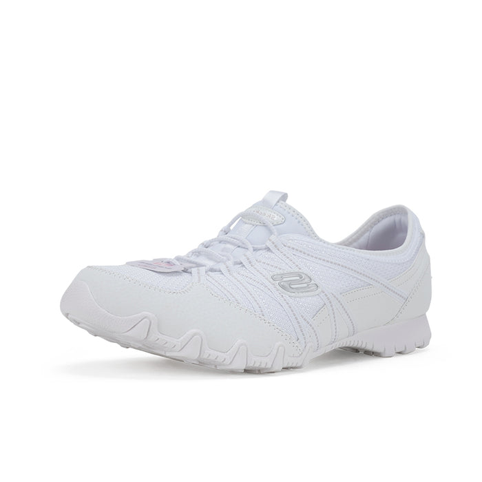 Women's white lace-up sneaker angled view with logo emblem and textured outsole tread