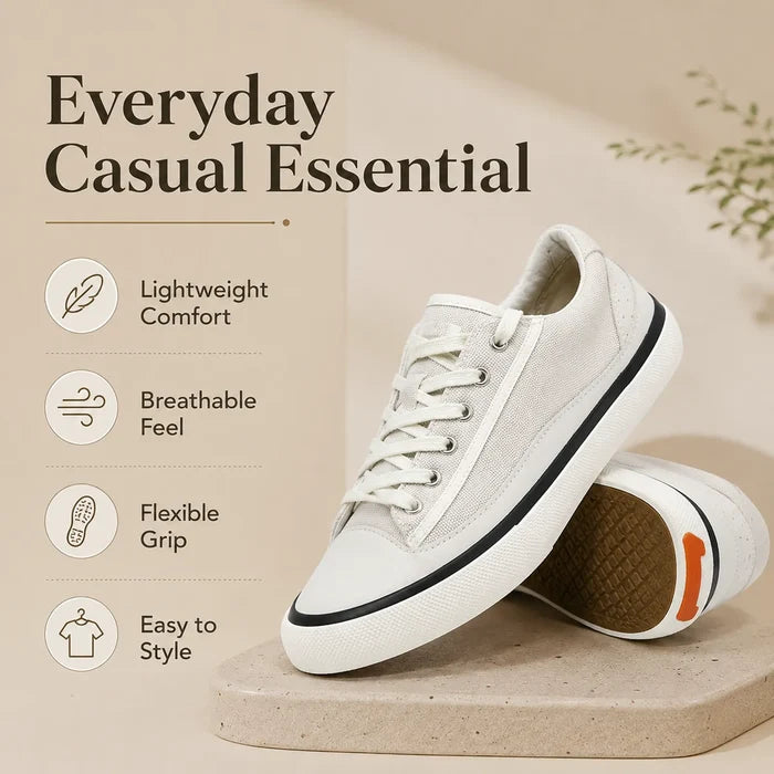 White lace-up low-top sneakers with cushioned interior and black trim