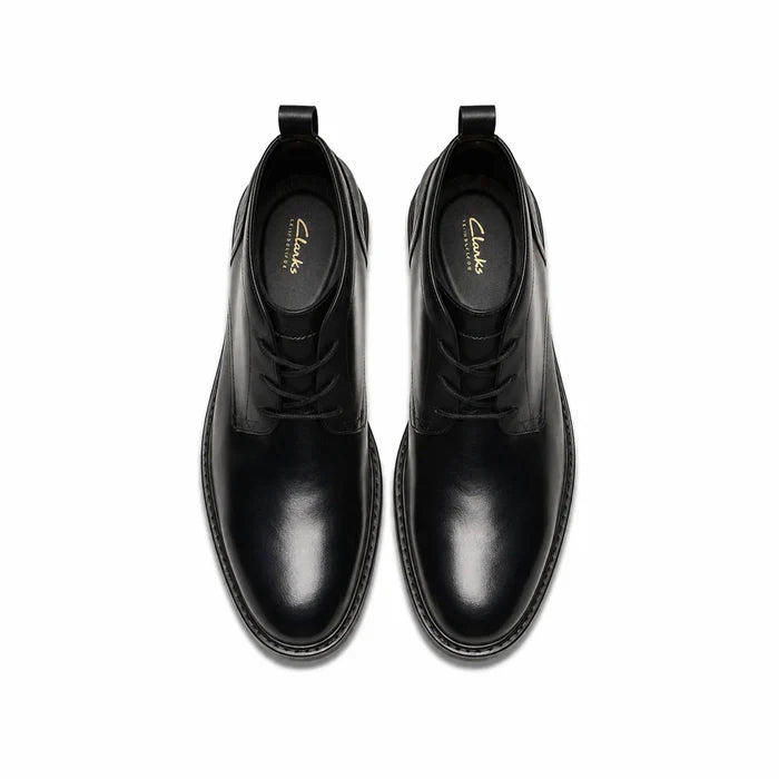 Pair of men's black leather chukka boots, front view with lace-up tops