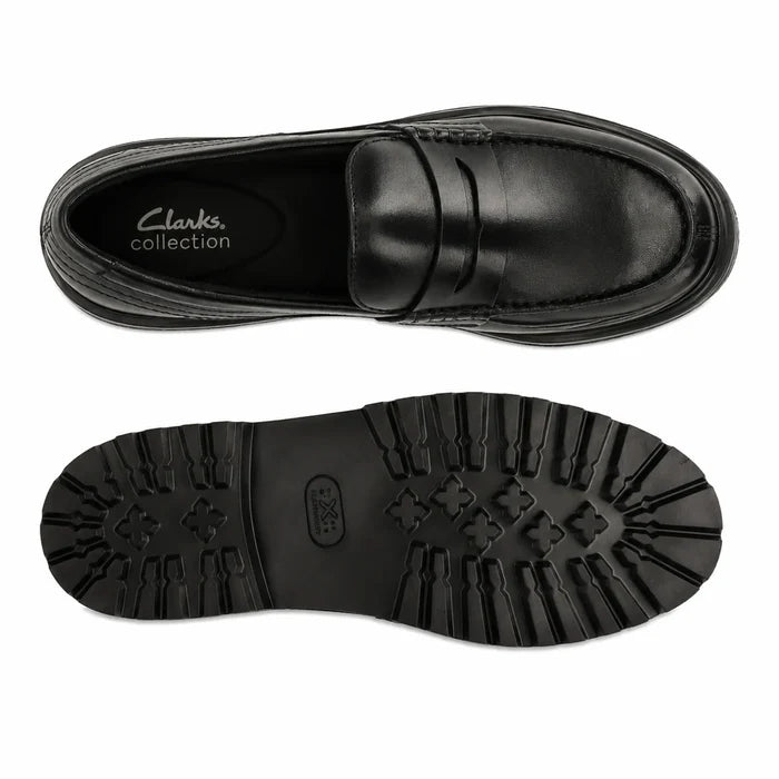 Black leather loafer top view with matching black lug rubber outsole