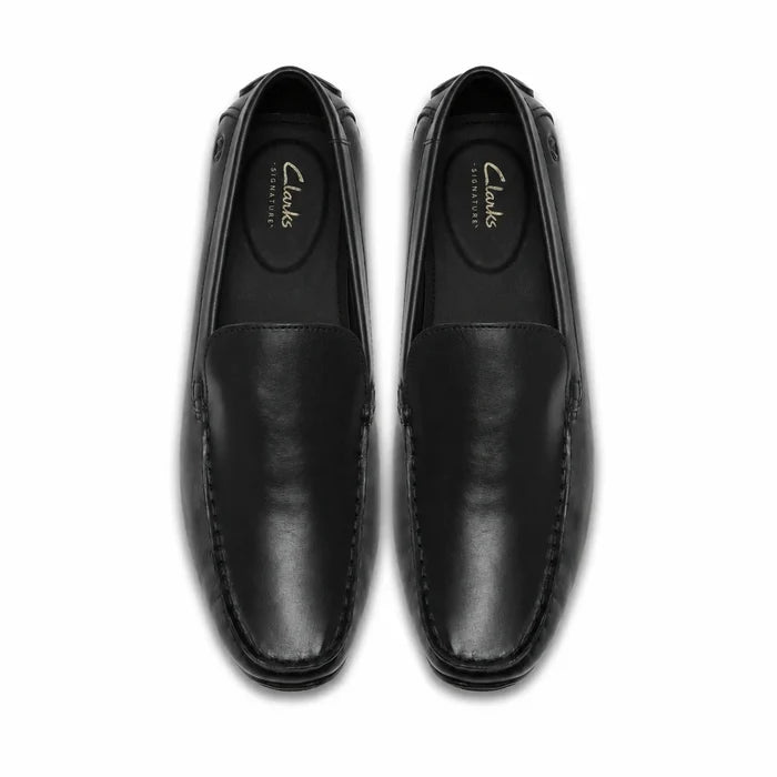 Black leather men's loafers, top view with moc toe stitching and seam detail