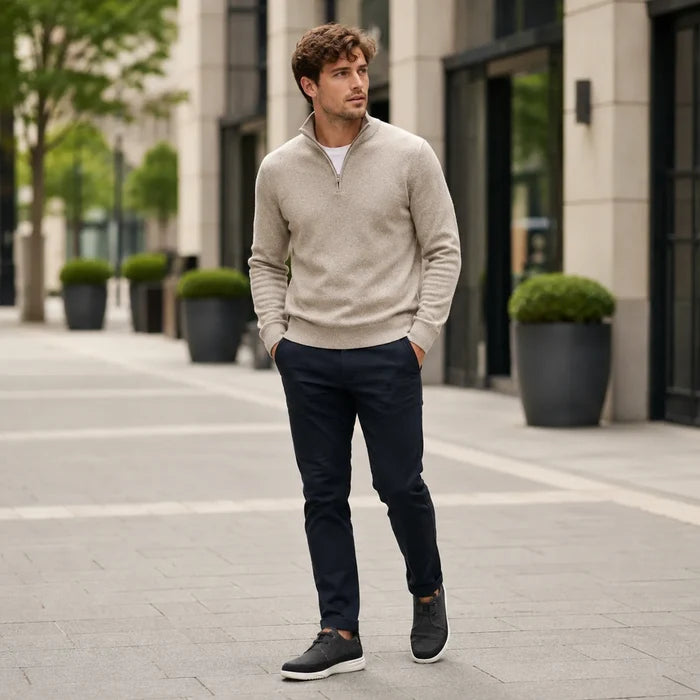 Men's black lace-up sneakers on a walking man, low profile with white sole