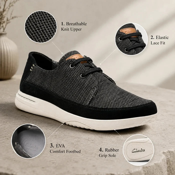Men's black lace-up sneakers with cushioned sole and textured mesh upper