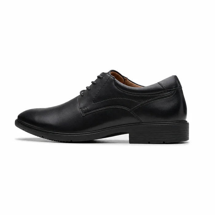 Black leather lace-up dress shoes with plain toe and stitched panels