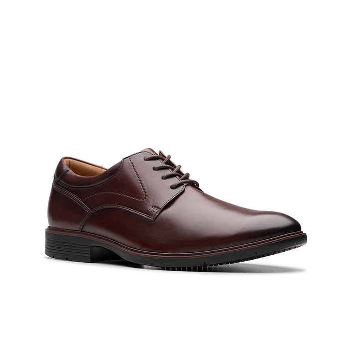 Oxblood leather lace-up business shoes with plain toe and stitched panels