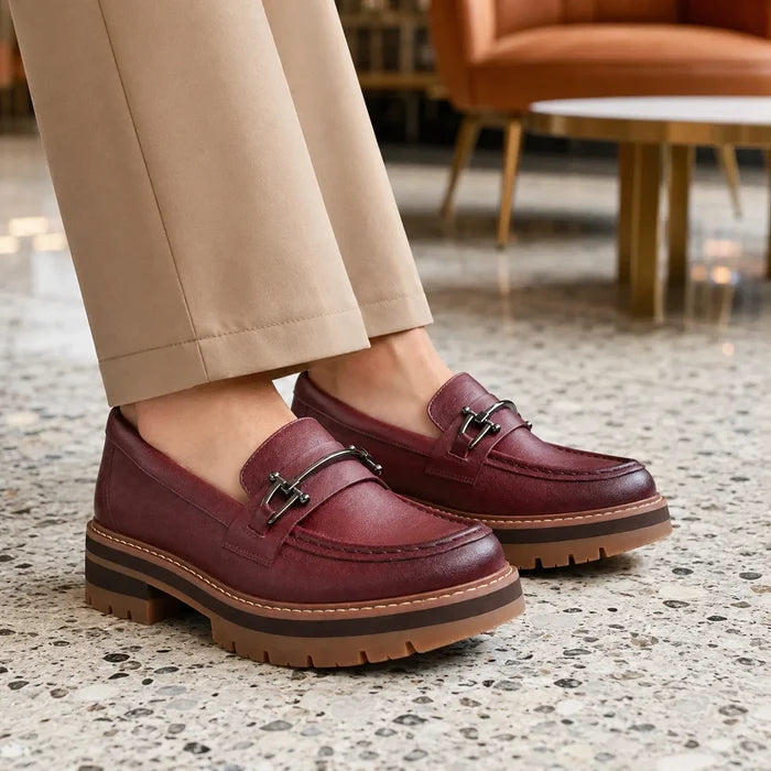 Oxblood leather bit loafers with metal buckle detail and thick tread sole