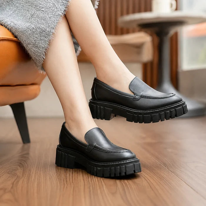 Black leather slip-on loafers with chunky platform sole and low block heel