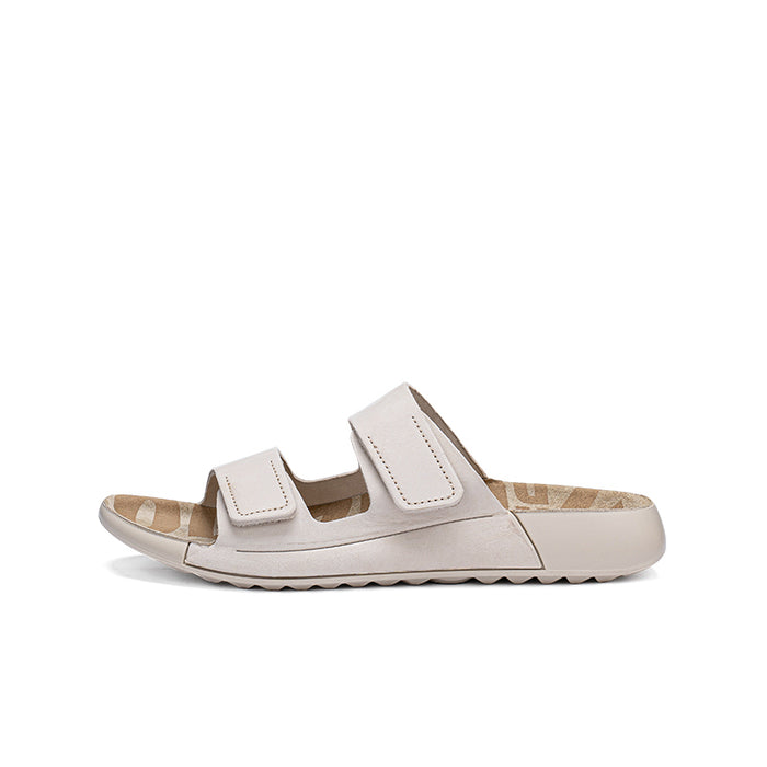 Beige leather slide sandals with two wide straps, low-profile sole