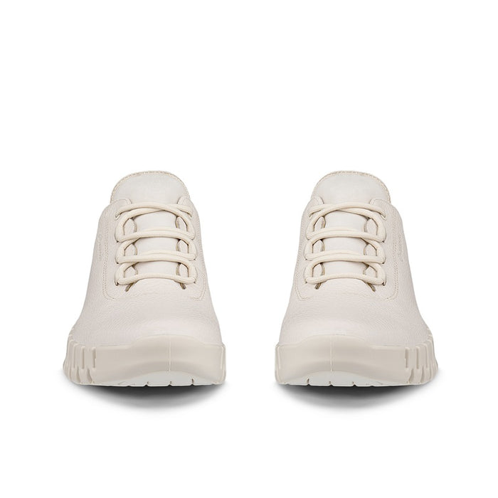 Light beige pair of lace-up sneakers with padded tongue and chunky outsole