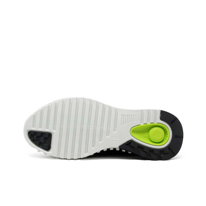 Men's sneakers outsole with white tread and green traction insert