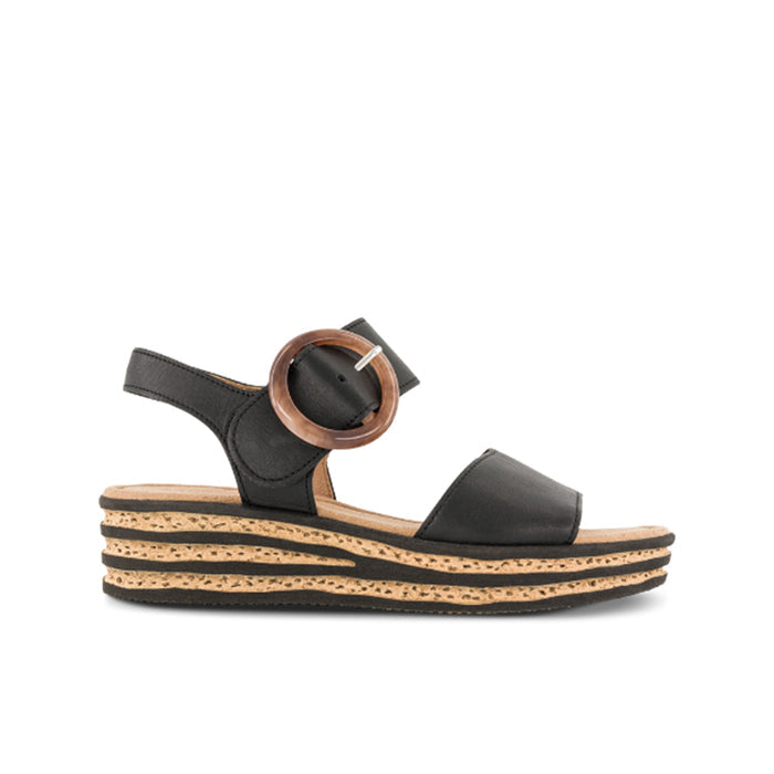 Black leather wedge sandals with wide strap and round buckle detail