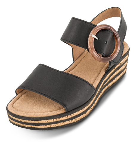 Black leather slide sandal with oval buckle strap on tan footbed
