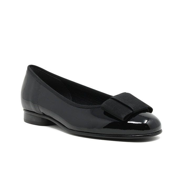 Black leather ballet flat with bow strap and low heel.