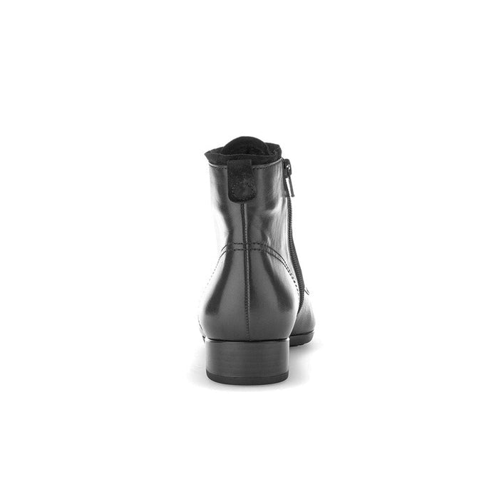Black leather ankle boot back view with pull-on collar and low stacked heel