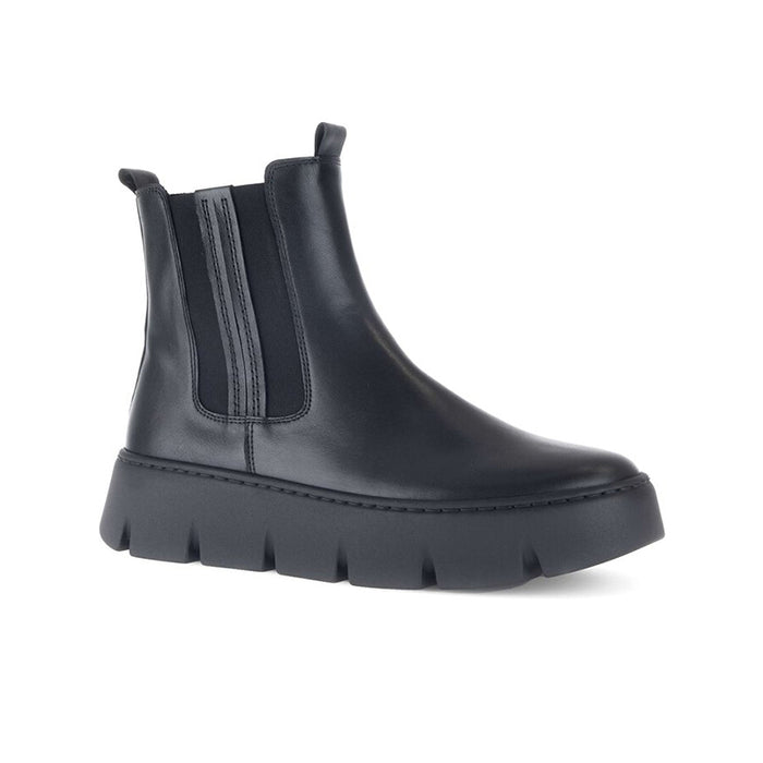 Black leather Chelsea boots with side elastic panels and thick tread sole