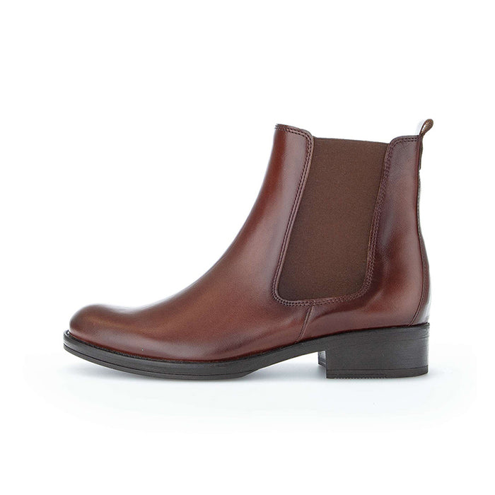 Brown Chelsea ankle boots with elastic side panels and stacked low heel