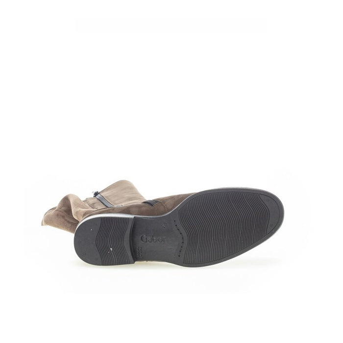 Brown long boots with rubber sole and low block heel underside view