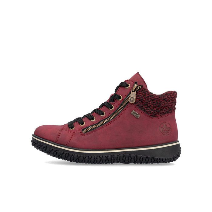 Red ankle boots with lace-up front, side zipper detail, and ridged rubber outsole
