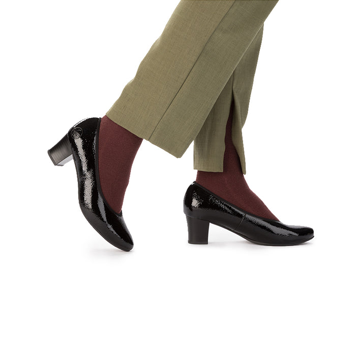 Black patent leather low-heel pump shown with burgundy socks and trouser cuff