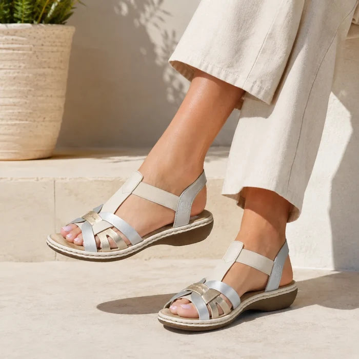 Metallic silver two-strap sandals with low cushioned sole