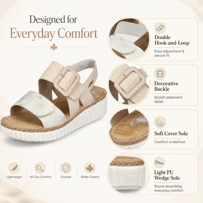 Beige wedge sandals showing double adjustable buckle detail and soft footbed