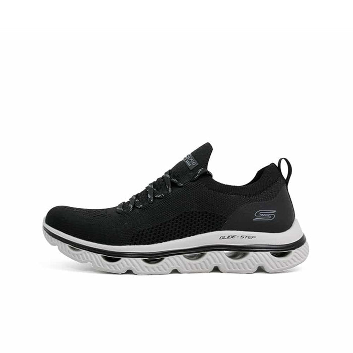 Black textile Skechers Arc Waves women’s sneaker with lace-up closure and cushioned sole.