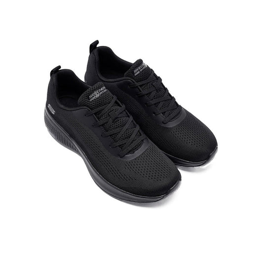 Black textile women's sneaker with lace-up design and thick dark sole