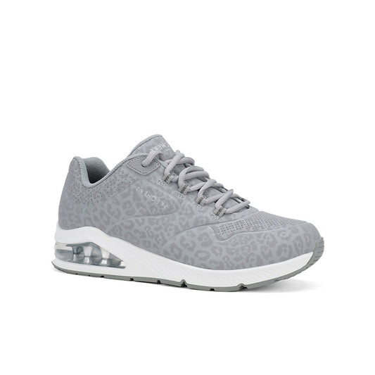 Grey women's low-top sneakers with lace-up closure and air-cushion heel