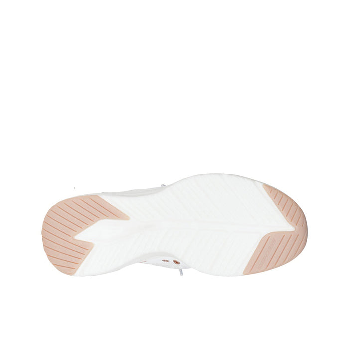 White sneaker outsole with light tread and tan rubber sections